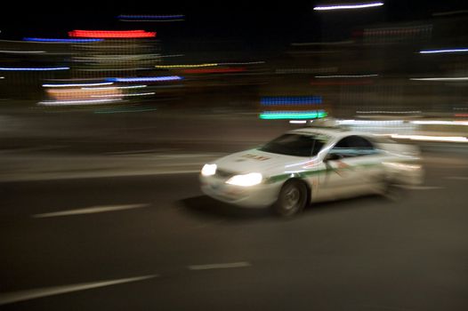white taxi at night, motion blur, Sydney