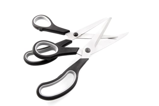 two pair of scissors on a white background