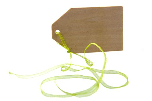 a wooden label with a green ribbon