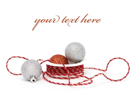 Christmas baubles with ribbon on white background (with sample text)