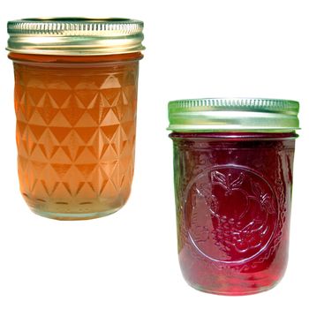  apple jelly and strawberry jam jars isolated over a white background