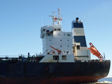 A large cargo ship heading out to sea