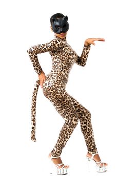 African dancer in leopard suit striking a dance pose