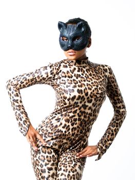 African dancer in leopard suit striking a dance pose in a cat mask