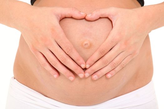 Pregnant belly with mom making heart shape with her hands on her belly over white.