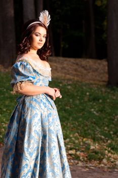 A portrait of lady in a blue baroque dress
