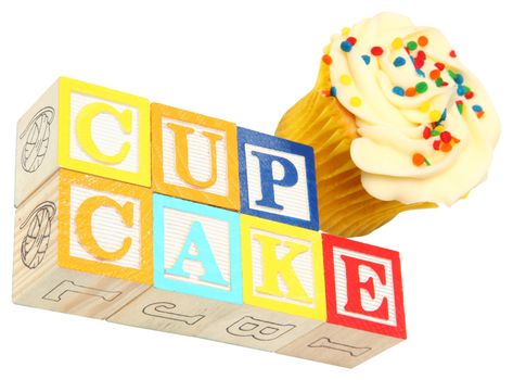 Cupcake spelled out in wooden blocks with a capcake over white