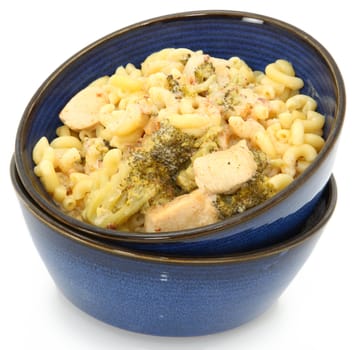 Chicken Alfredo with Broccoli and Macaroni in blue bowls over white background.