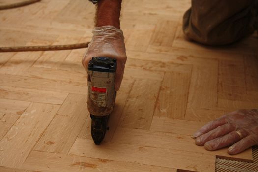 Electric stapler, used for laying a wooden fishbone pattern floor