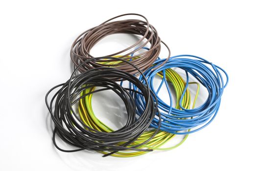 Colorful coils of cables on a white background