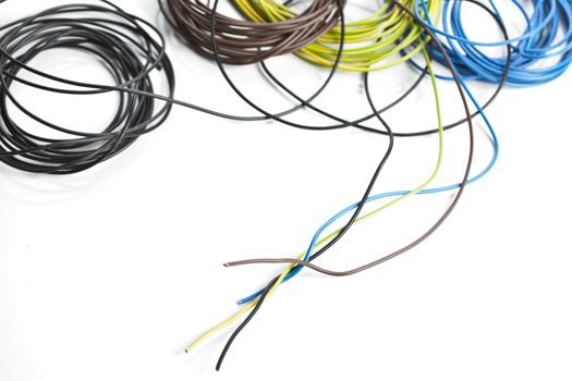 Colorful coils of cables on a white background