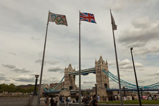 London, UK, July 2010 - Olympic & British flags in front of Tower Bridge