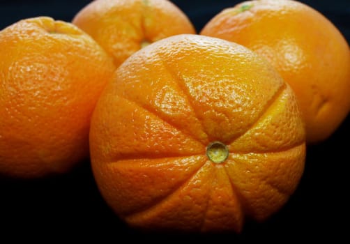 Oranges towards black background