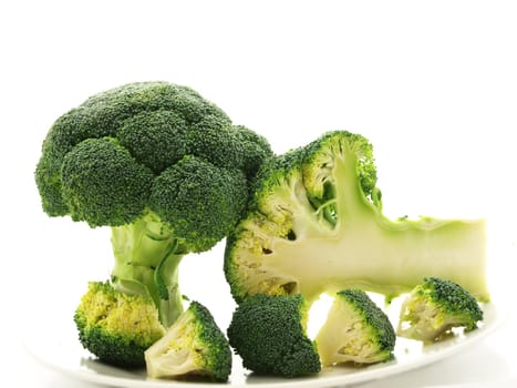 Broccoli isolated towards white background on a white plate