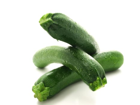 Whole zucchini vegetable isolated towards white background