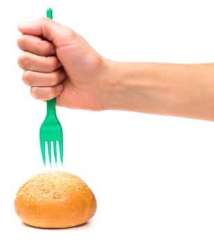 Hand with a fork in the bun isolated on the white background