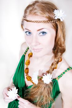 Red-headed sensual woman with flowers