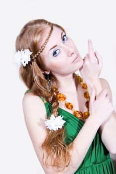 Red-head sensual woman in green dress with flowers