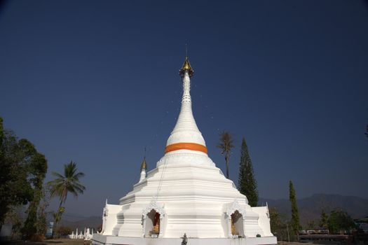 snow-white Pagoda  or temple against a blue sky - horizontal