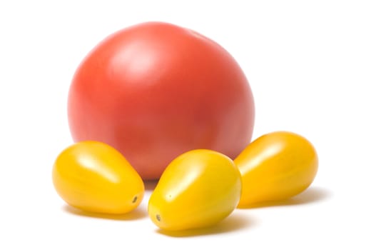 Yellow and red tomatoes isolated on white background.