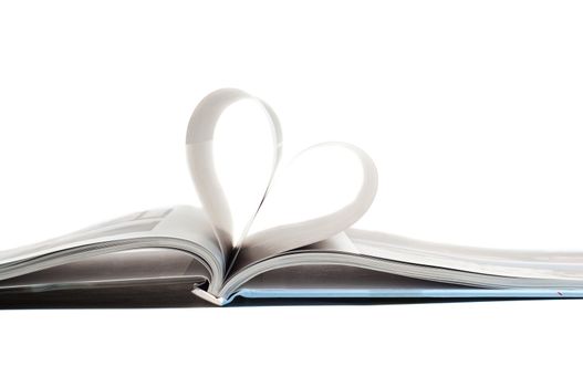 Shot of heart in book, isolated on white