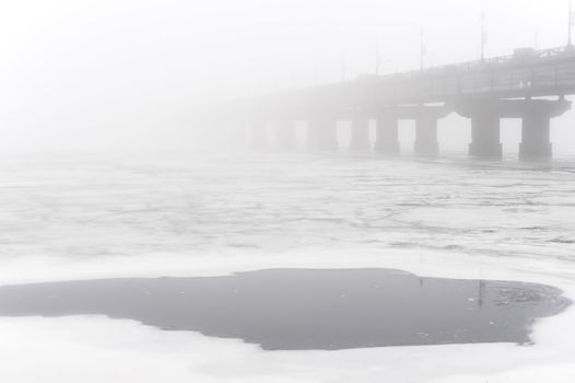 Paton bridge in the foggy day. Kiev. Ukraine