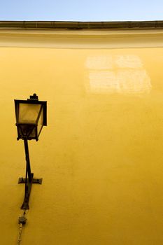 Reflection of a window on a yellow wall