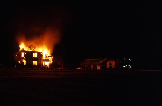 A house is burning in evening