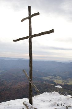 Cross on top of the Carpathian mountain Pikuy. Ukraine