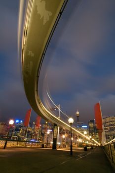 Sydney monorail, blurred train in motion, pyrmont bridge, cbd in background