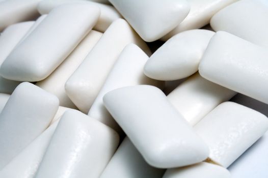 several white chewing gums, detail photo