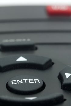 detail photo of remote controller with only ENTER button in focus