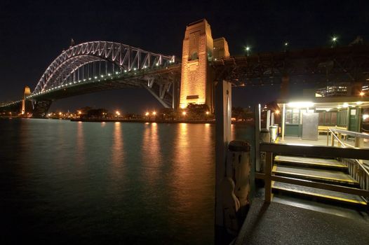 night scene of Harbour Bridge in Sydney, photo take from wharf at Kirirbilli