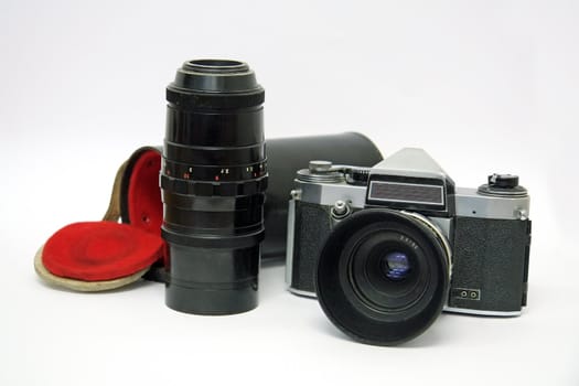 old analog camera on white background, additional telephoto lens
