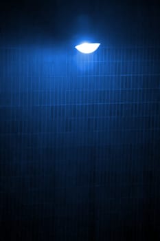 cold blue lighted brick wall