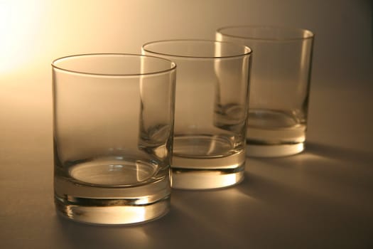 three empty cocgnag glasses, distance blur