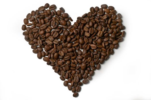 Heart made out of coffee beans on white background