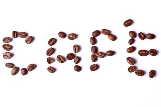 Lettes made of coffee beans spelling CAFE on white background