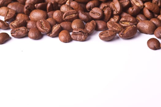 Stack of coffee beans on white background