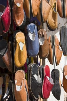 Shoes hanging outside a shop in Marrakech