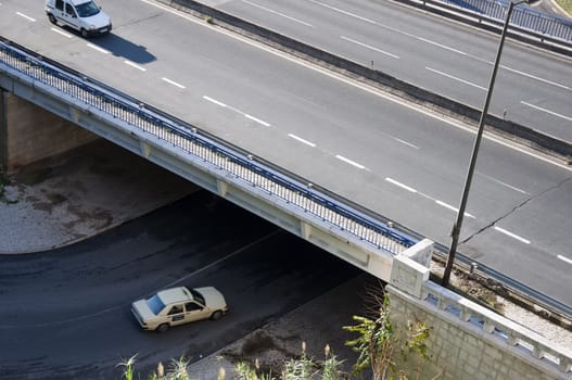 Portugal road leading under the bridge