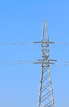 High-voltage tower with blue sky