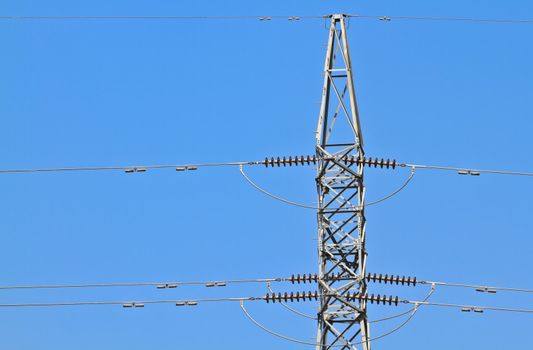 High-voltage tower with blue sky