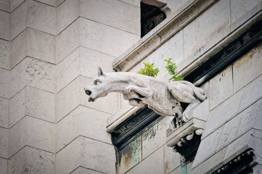 One of famous Chimeras on the cathedral Notre Dame