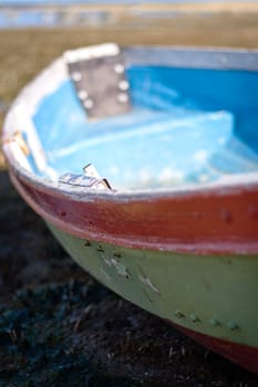 lonely fishing boat on a beach, shallow DOF