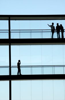 people inside the modern building in silhouette