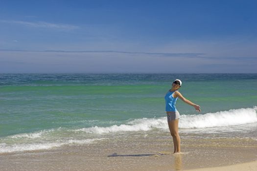 Beautiful woman having fun on the beach 