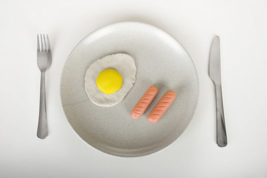 Concept about (realy) plastic food on a plate