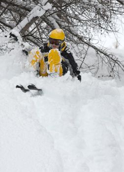 Skier coming down a wild slope with fresh snow