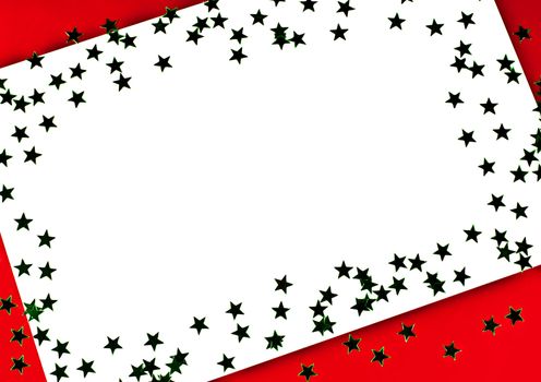 On a red background white greeting card with green stars